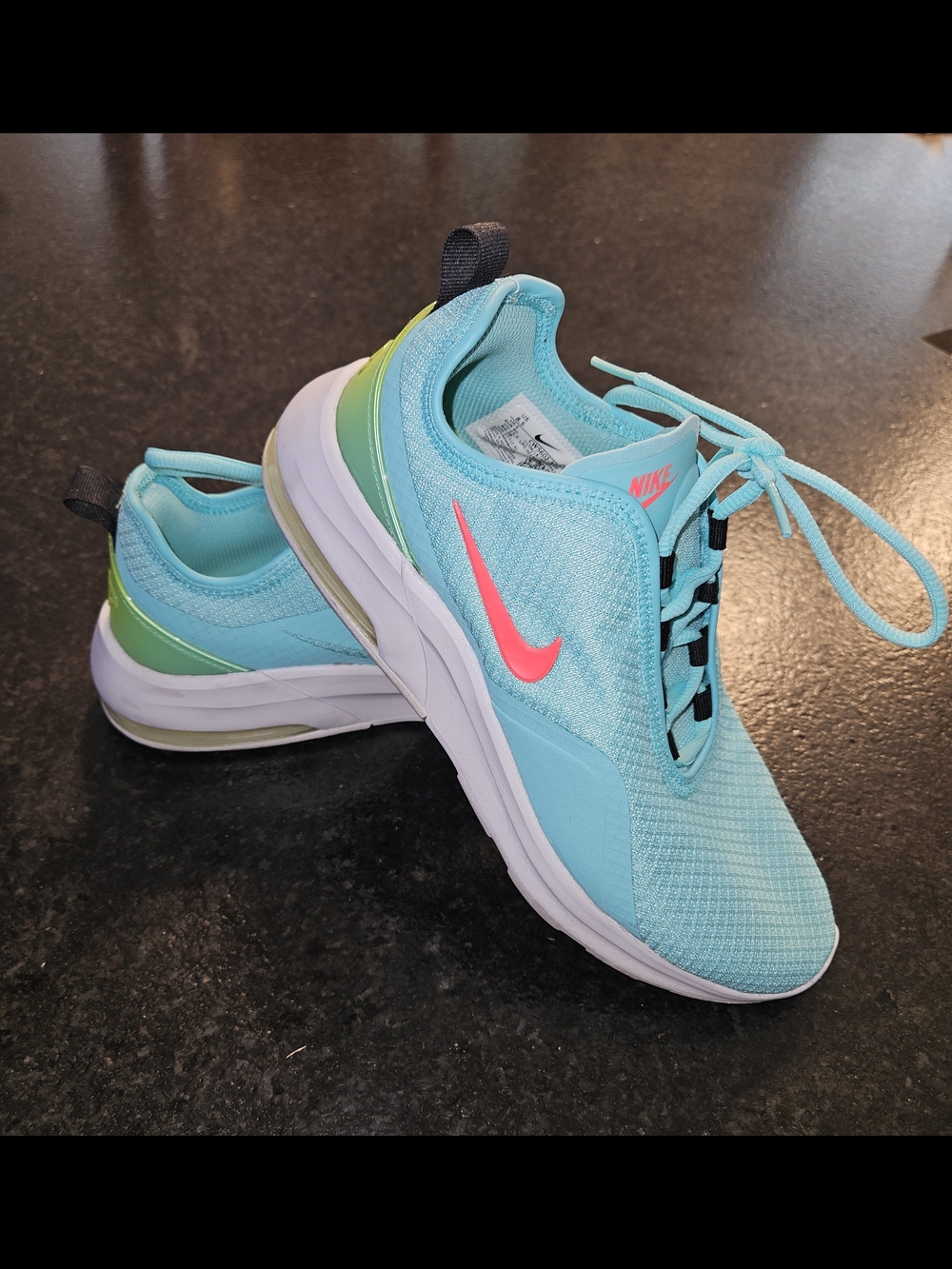 Nike Light Aqua Running Shoes with Pink Swoosh
